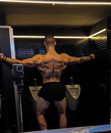 a man in a black underwear suit with a muscular body