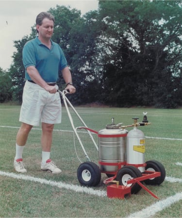 Paint a football field and soccer field using a trueline grass paint striping machine