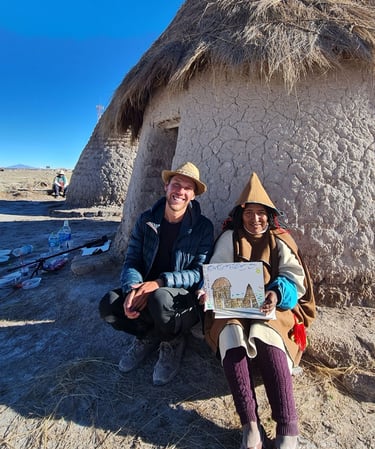 Monsieur rêve et une femme Chipayas en tenue traditionnelle avec le dessin de son rêve
