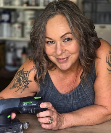 Owner of Absolutely Mintage - Julia -  holds a Festool sander