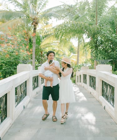 xFamily walking on resort bridge during Sofitel Nusa Dua Bali family photography session