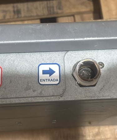 a person holding a metal box with a blue arrow