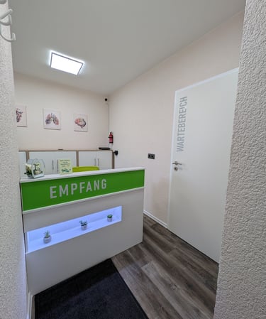 a reception desk with a green and white reception table