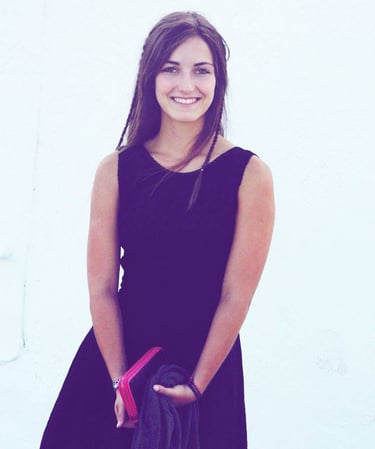 a woman in a black dress and a black jacket