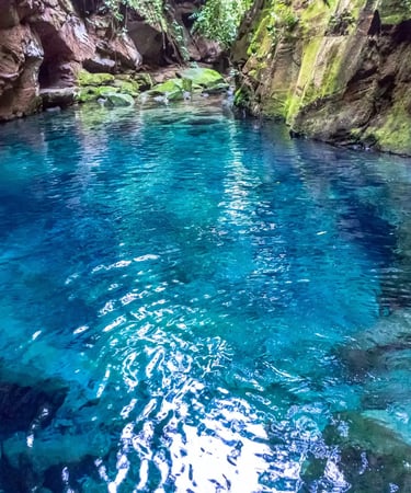 a river with a waterfall and a waterfall