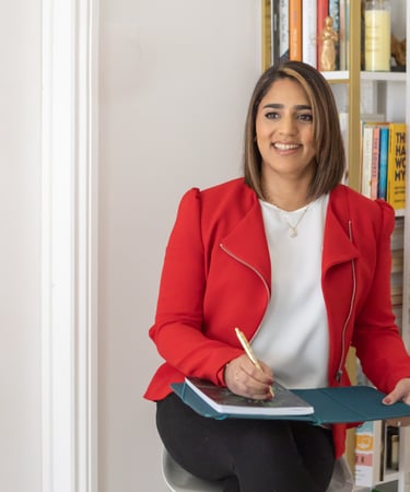 A photo of Anita with a note pad and pen.