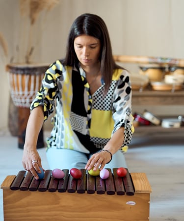 a woman playing a musical instrument with a musical instrument