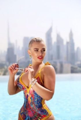 a woman in a swimsuit is posing for a picture