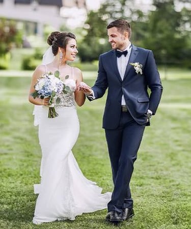 a bride and groom walking down the aisle of a wedding