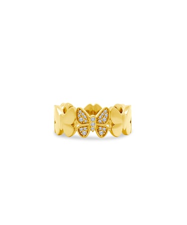 a gold ring with a butterfly on it
