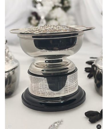 a silver plated rosebowl with engraved band on base