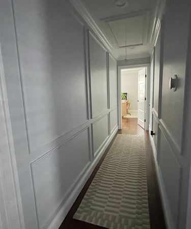 Narrow hallway with custom wall panels and architectural trim in Monmouth County NJ