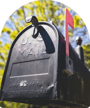 black mailbox with red flag signifying there is mail 