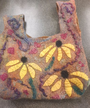 Handmade colorful wet felted wool bag with yellow floral sunflower designs and textured felt