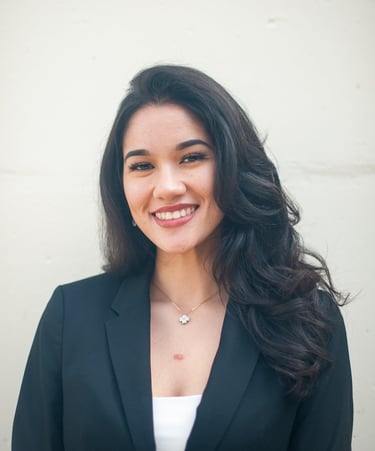 a woman in a black suit and white shirt