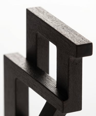 Abstract high-contrast 3D geometric structure, sharp metallic edges, dark charcoal and pure white lighting, studio background, macro shot, clean minimalist composition