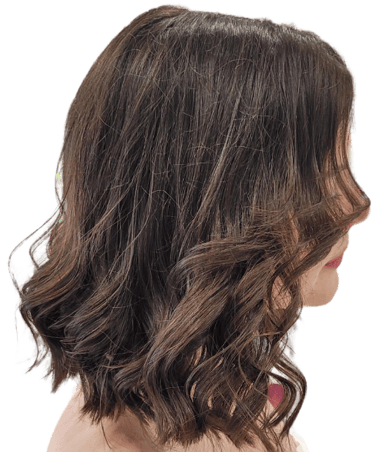 Woman with soft, layered haircut and blow-dry finish