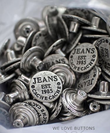 Metal buttons, zipper pulls, and clothing hardware with custom branding