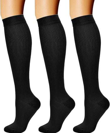 three pairs of socks with black and white socks