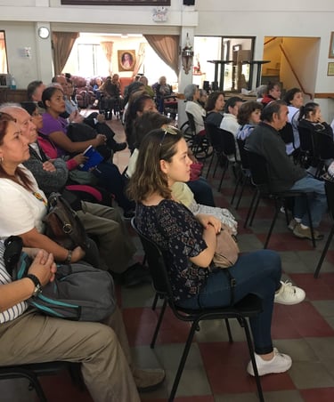 a group of people sitting in chairs in a room