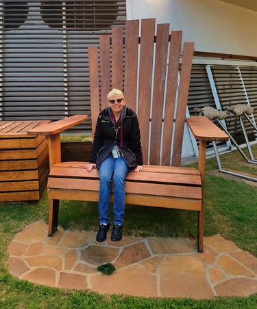 Lady Michelle rests on a rather large lawn chair on the ship