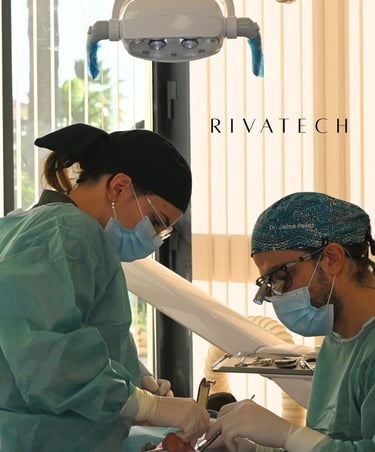 Professional dental surgeons performing a procedure using advanced medical technology at Rivatech clinic.