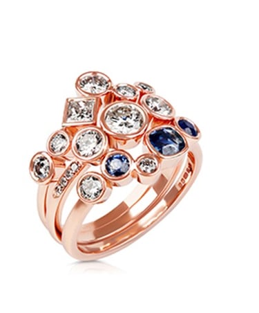 a rose gold ring with sapphire and diamonds