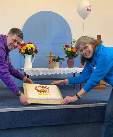 People with a celebration cake