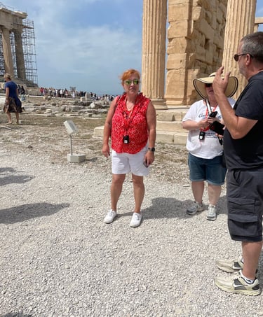 Picture of Teva leading a travel group through the Acropolis in Athens, Greece.