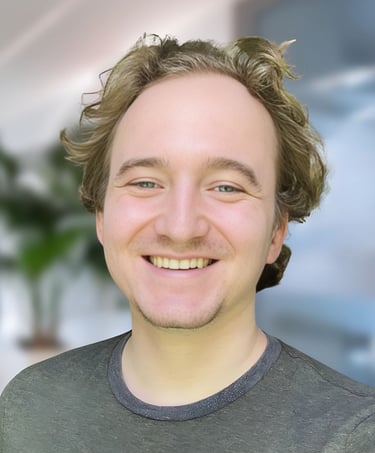 a man with a beard and a beard smiling