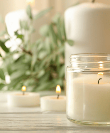 a candle with candles and candles on a table