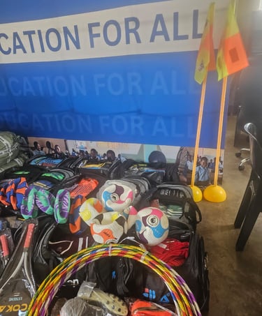 a bunch of bags with sports items and a wall banner