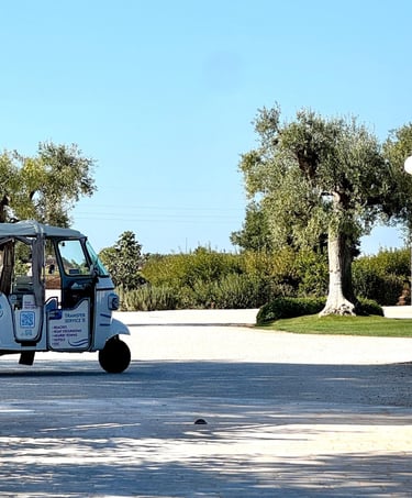 Masseria entrance with ape calessino tuktuk parked
