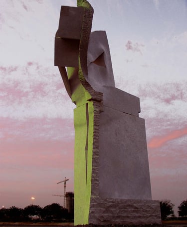Large abstract marble sculpture bathed in shades of gray and neon green by a pink sunset sky.