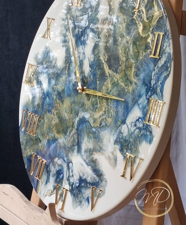 handmade clock from epoxy resin in blue and gold colours