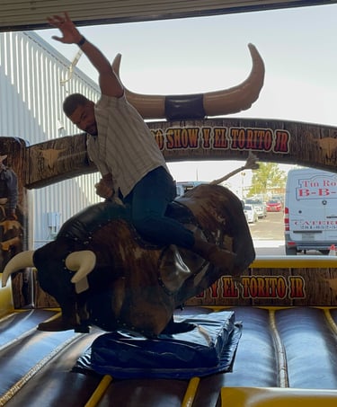man riding mechanical bull