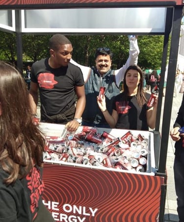 a man and woman standing in front of a sign