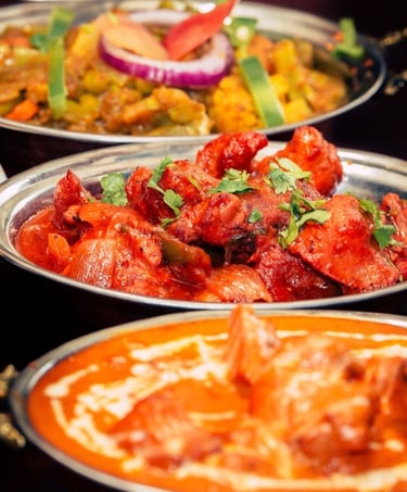 a variety of authentic chicken recipes and veginetrian items on a table