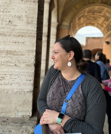 A woman standing atop Castel Sant'Angelo in Rome, Italy