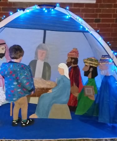 Child at a nativity scene