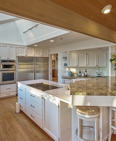a kitchen with a large island and a large island