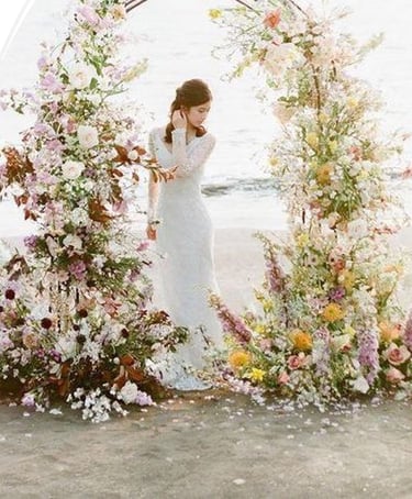 Beach wedding ceremony setup with floral arch and elegant decor in Bodrum