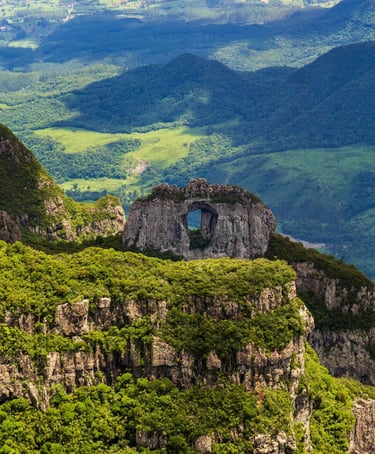 a mountain view of a mountain range with a small window