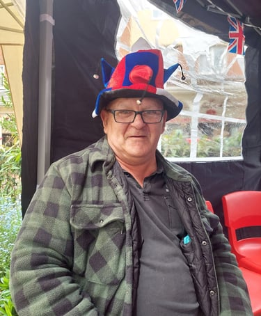 a man in a hat with a hat on