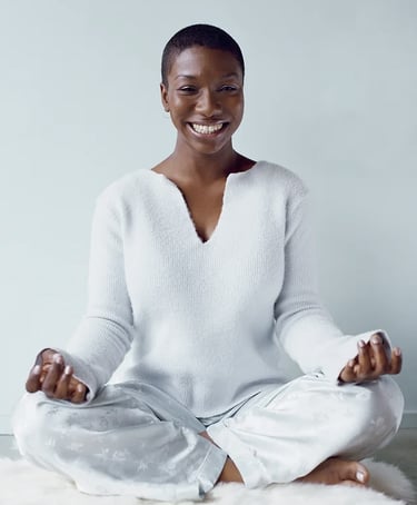 woman smiling, tranquil, healing from stress.