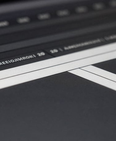 Macro close-up of a dark video editing timeline interface, high-contrast monochrome UI layout, sharp white tracks on deep grey screen, minimalist aesthetic