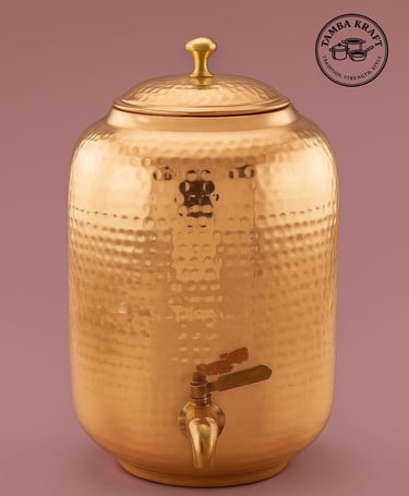 a golden metal beverage dispenser with a faucet