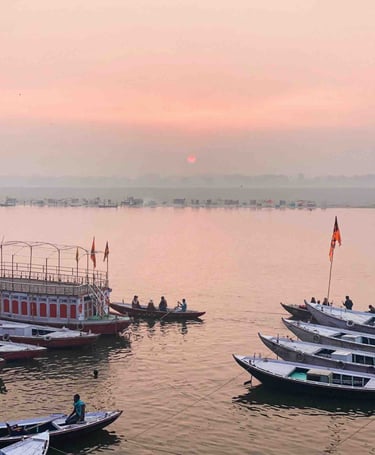 Numerous boats at sunrise on the Ganges River in Varanasi, India.