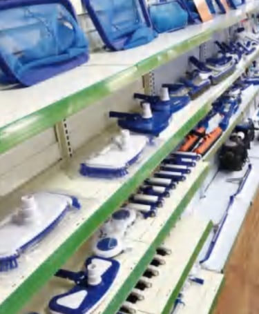 pool equipment company nets and poles on shelves