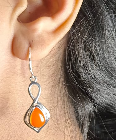 a woman's earrings and earrings